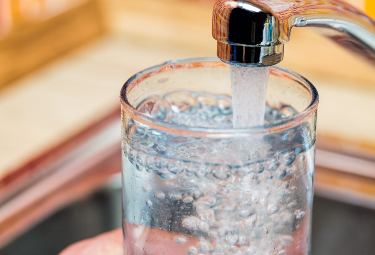 Filling up a glass with drinking water 