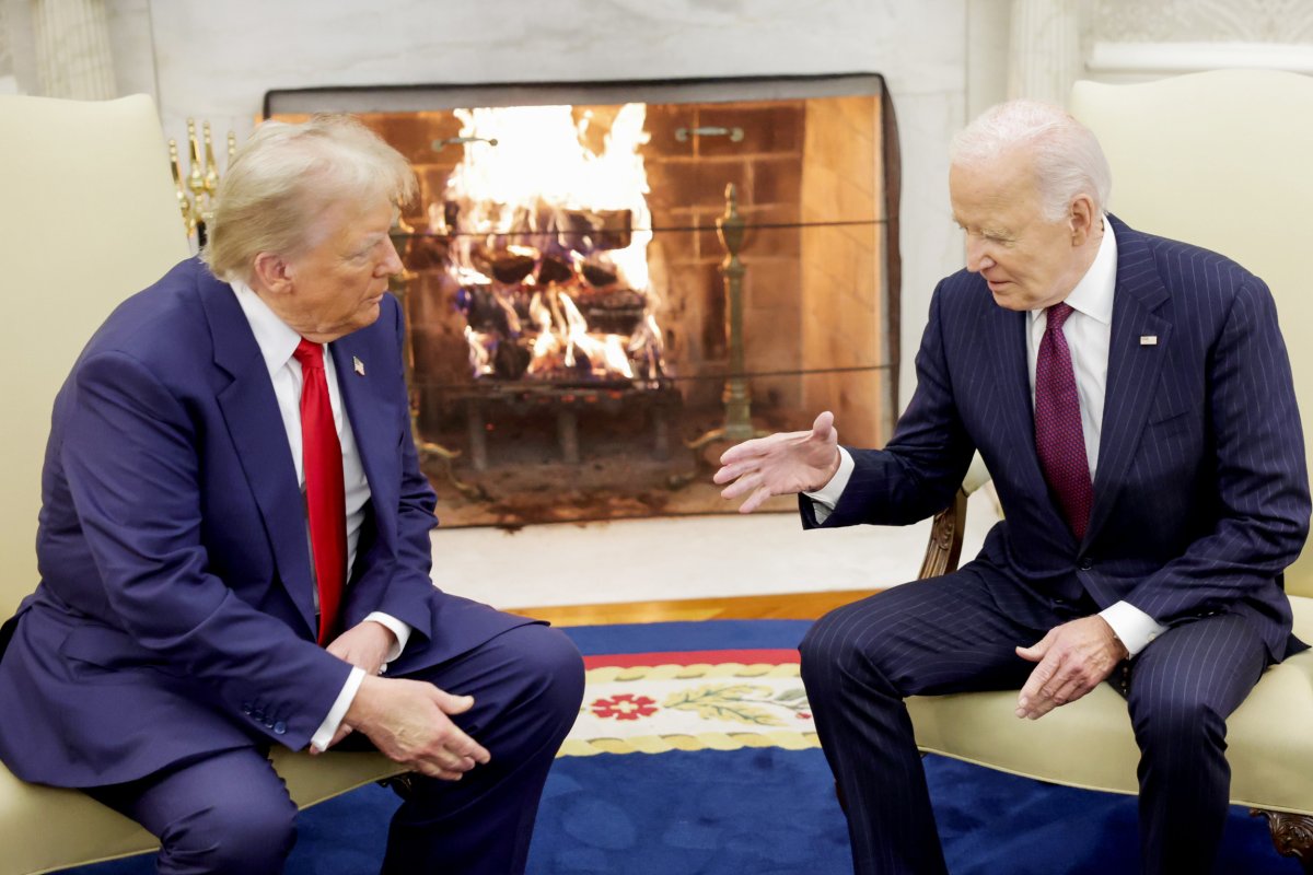 Donald Trump shakes hands with Joe Biden