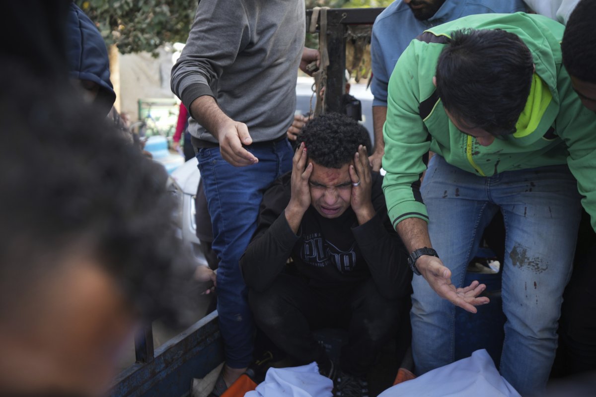 Palestinians mourn their relatives