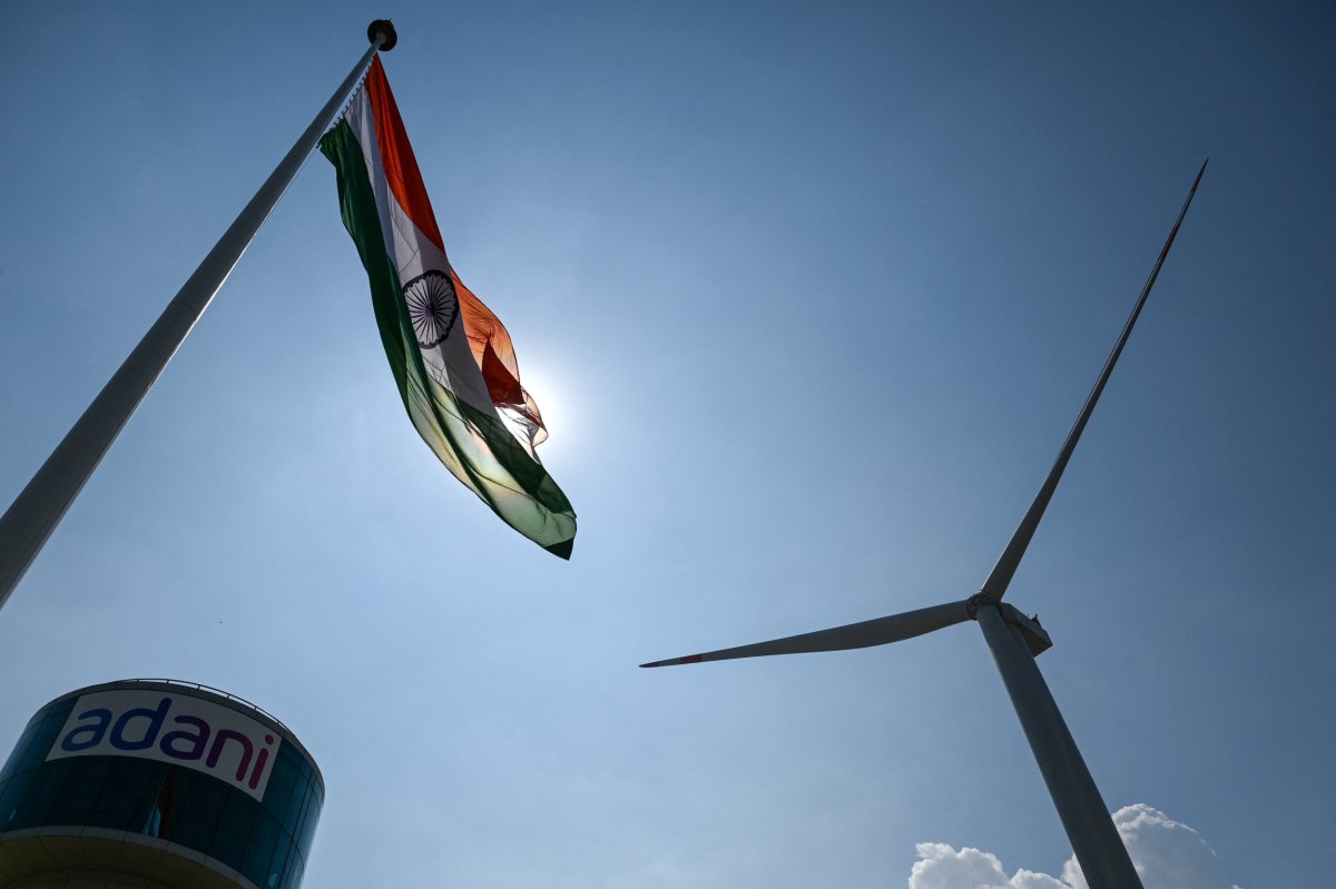 Indian flag waving next to wind turbines