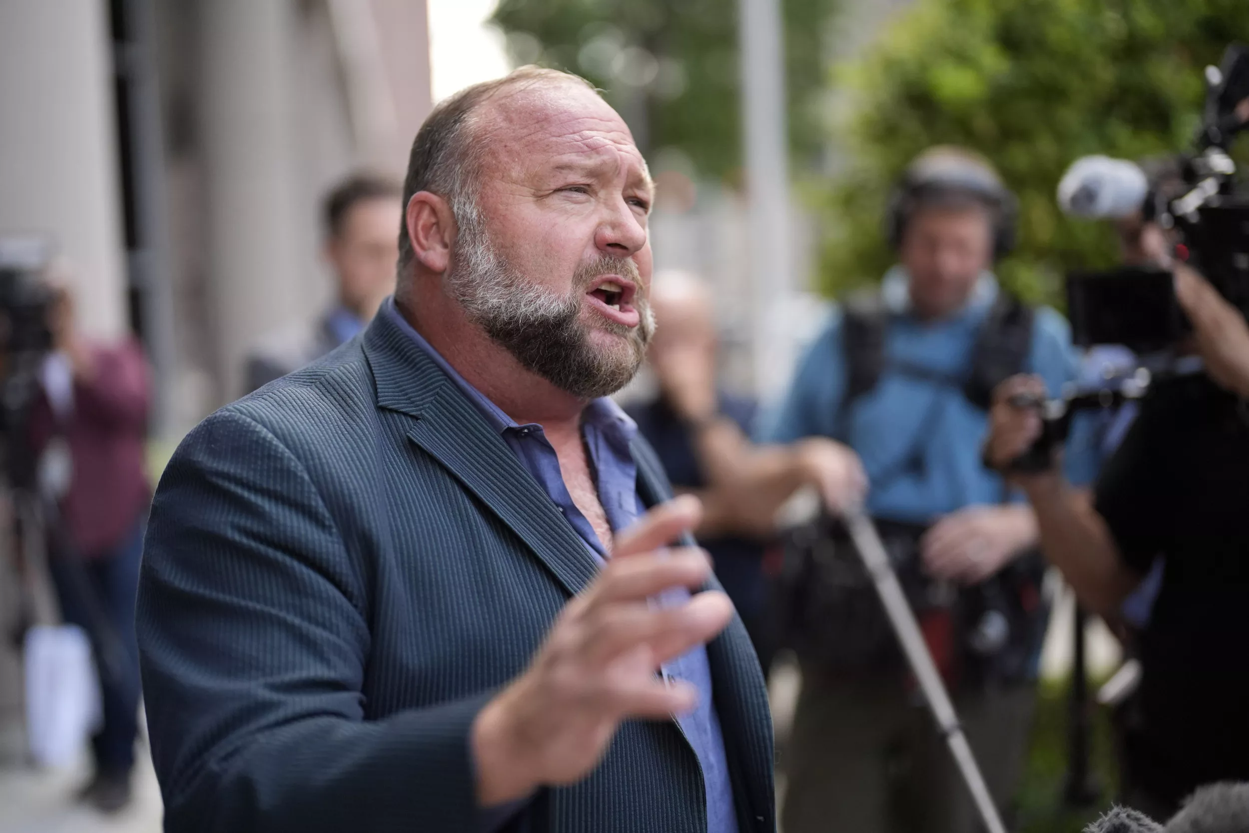 Judge to hear Alex Jones' bid to block The Onion's Infowars purchase