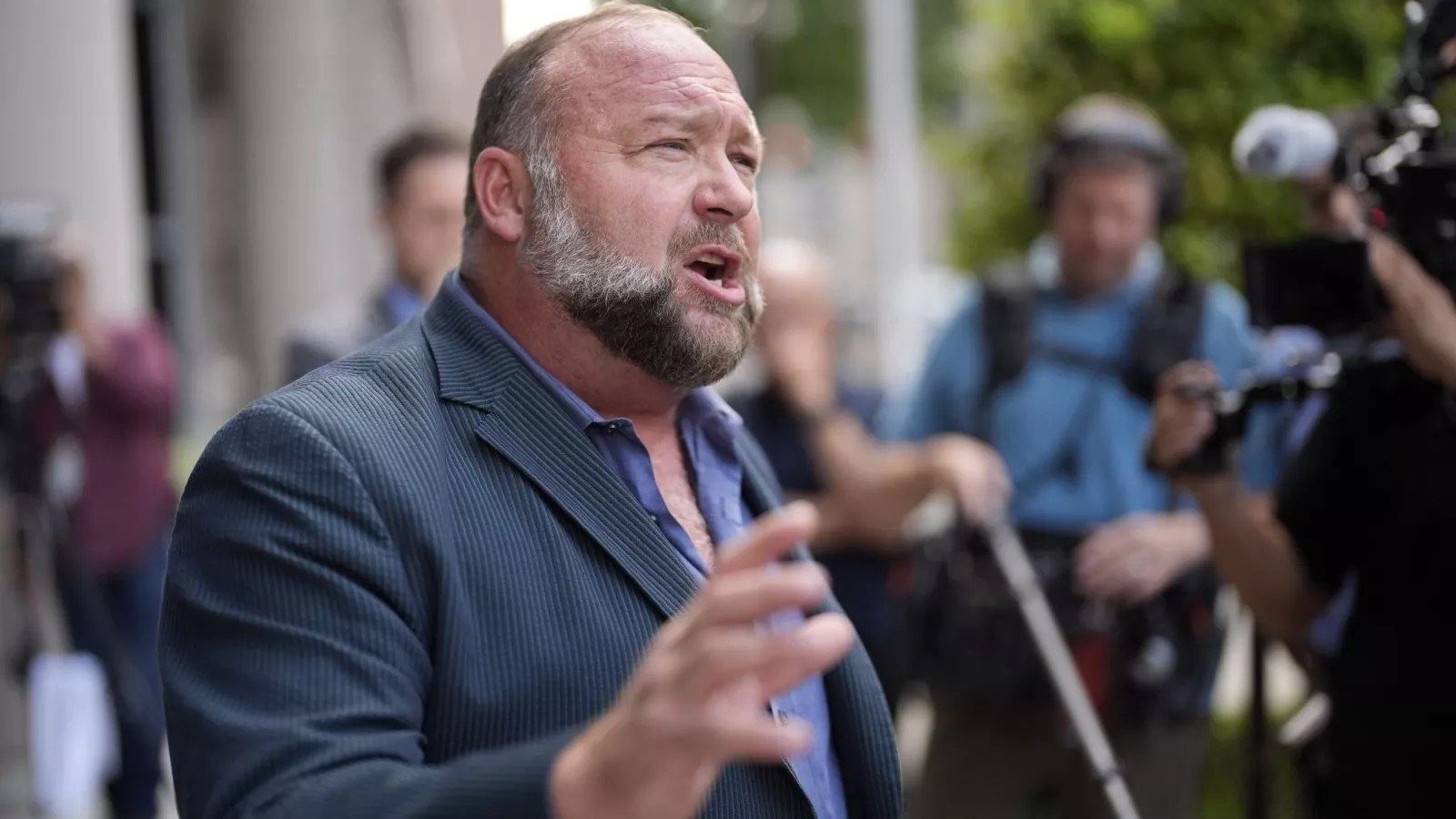 Judge to hear Alex Jones' bid to block The Onion's Infowars purchase