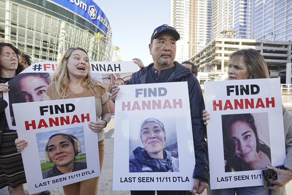 Ryan Kobayashi holding a Hannah Kobayashi poster