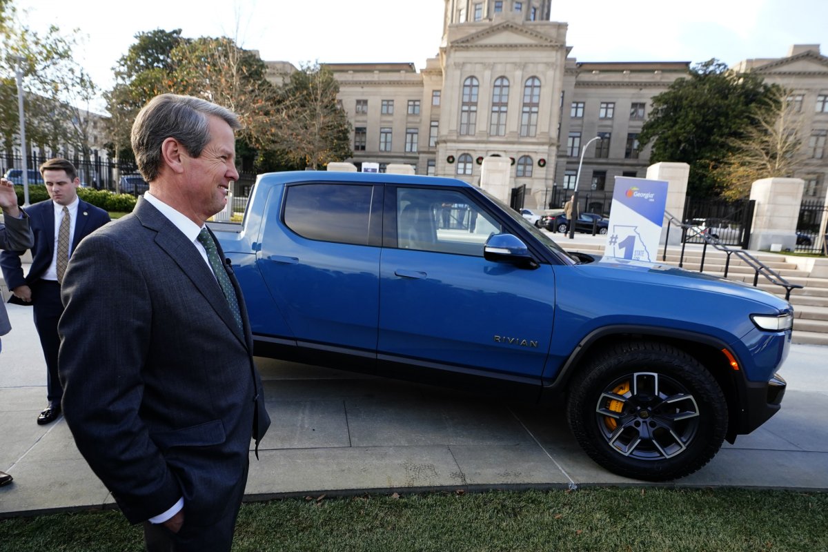 Gov. Brian Kemp and a Rivian