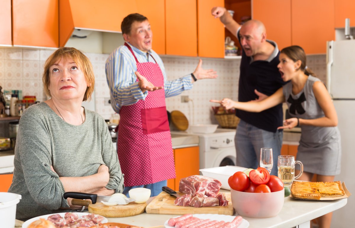 Family arguing in kitchen.