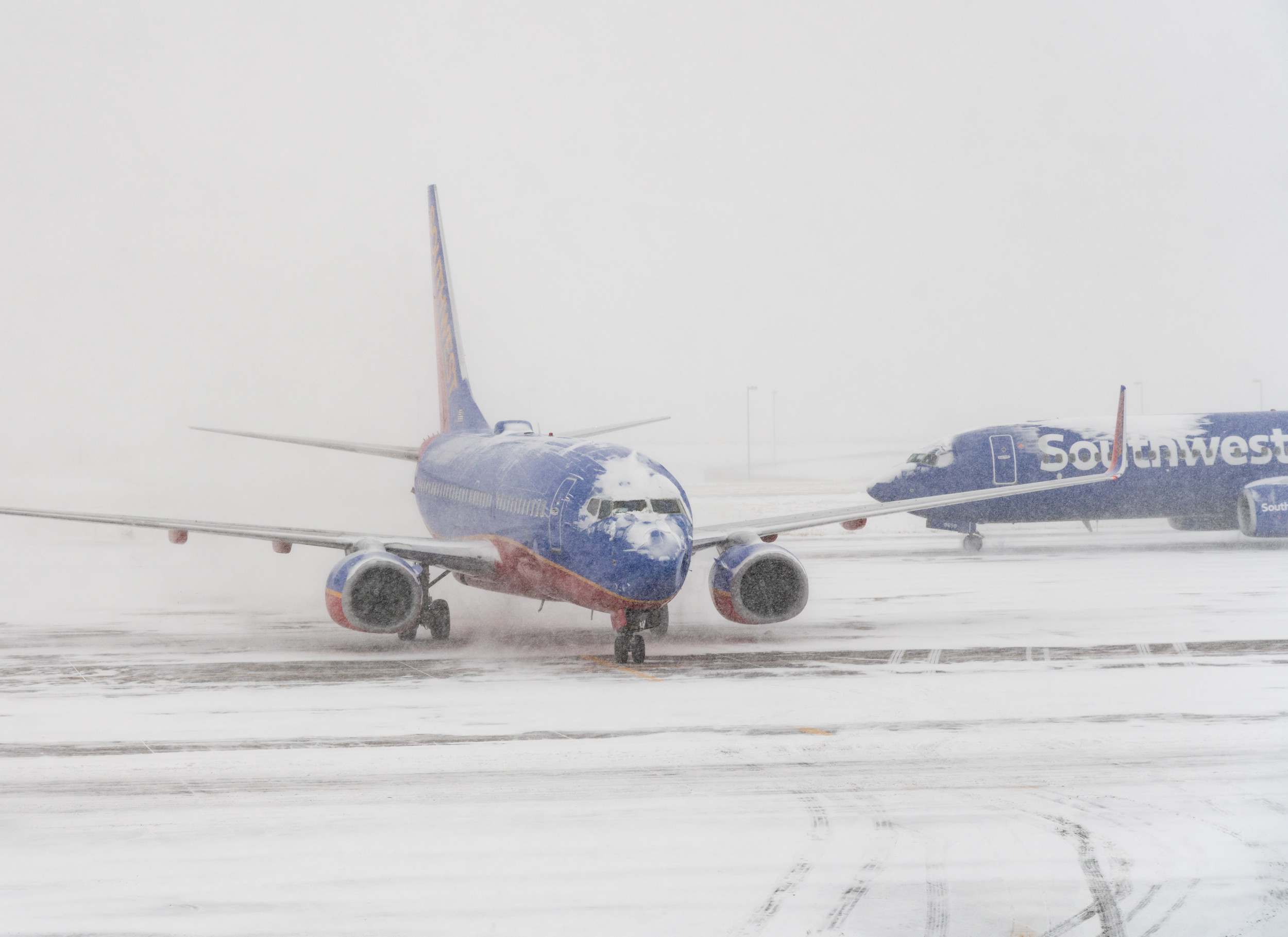 More than 50 flights canceled and 1,400 delayed as winter storms hit the United States