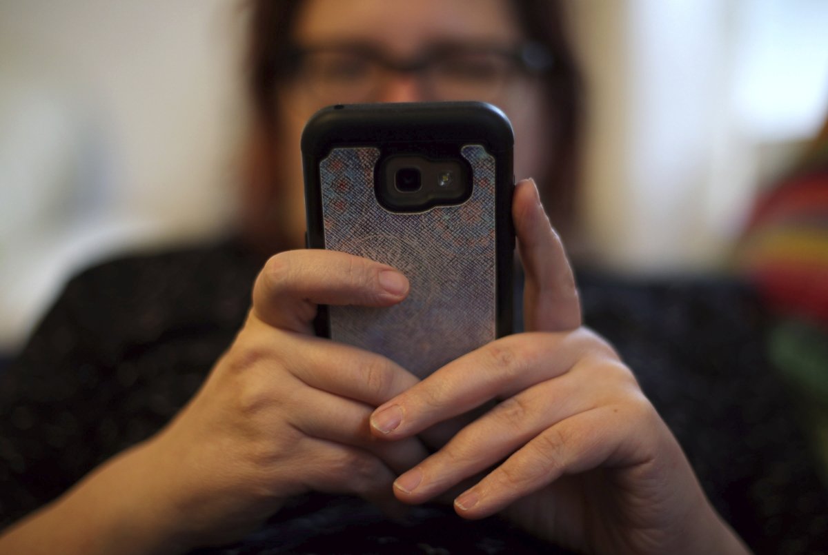 Oxford University Press 2024 Word of the Year revealed 3 Woman on mobile phone