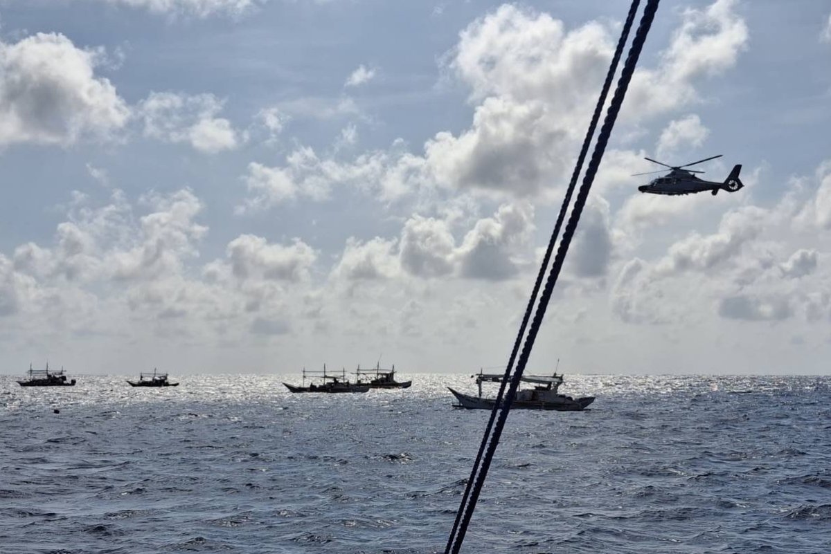 Helicopter Hovers Over Philippine Fishing Boats
