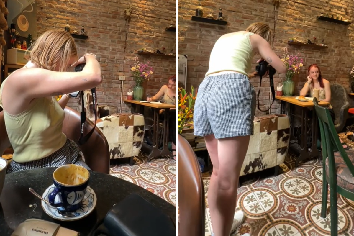 Woman photographs stranger coffee shop