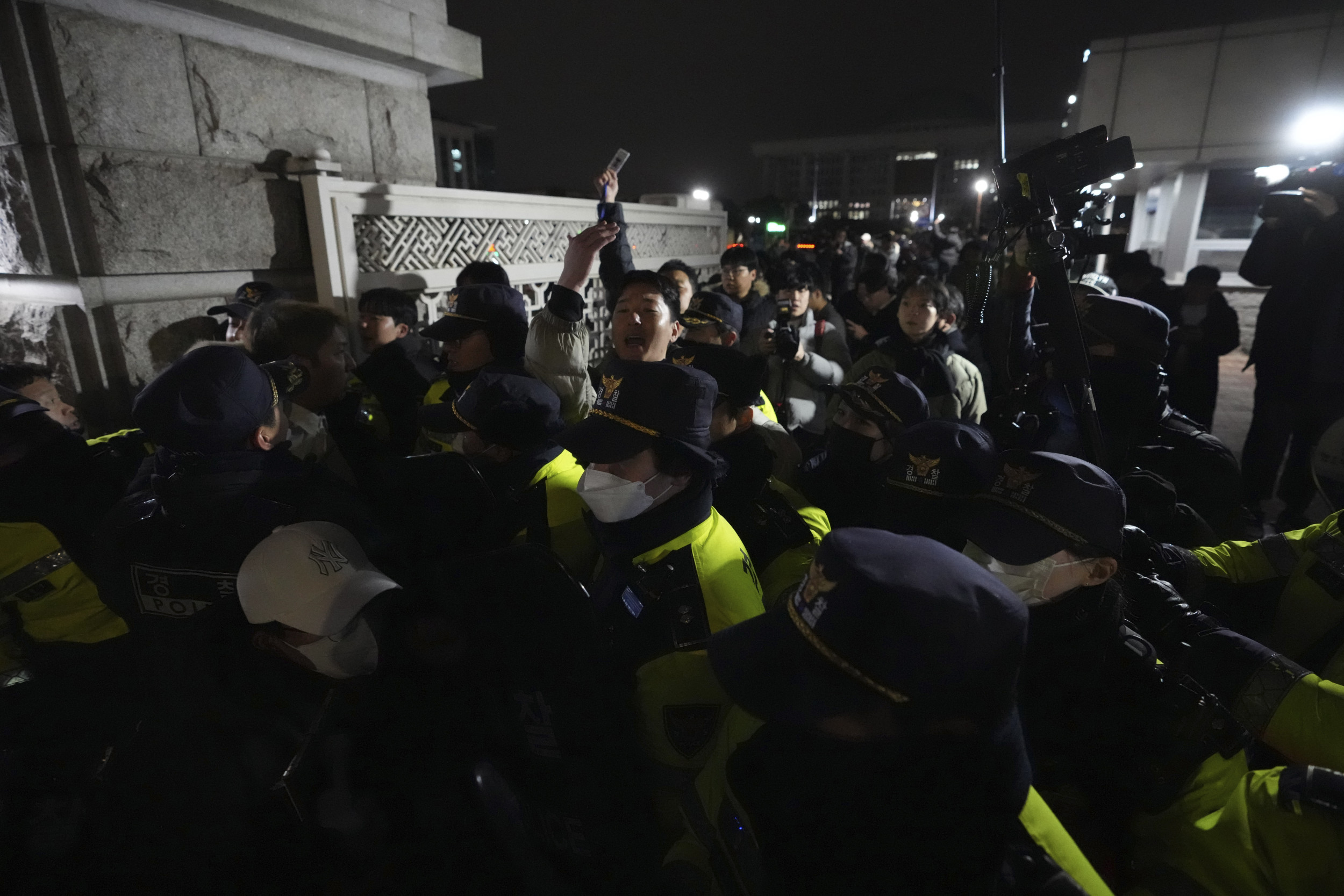 Police officers stand guard in front of the National Assembly in Seoul, South Korea, Tuesday, Dec. 3, 2024. (AP Photo)