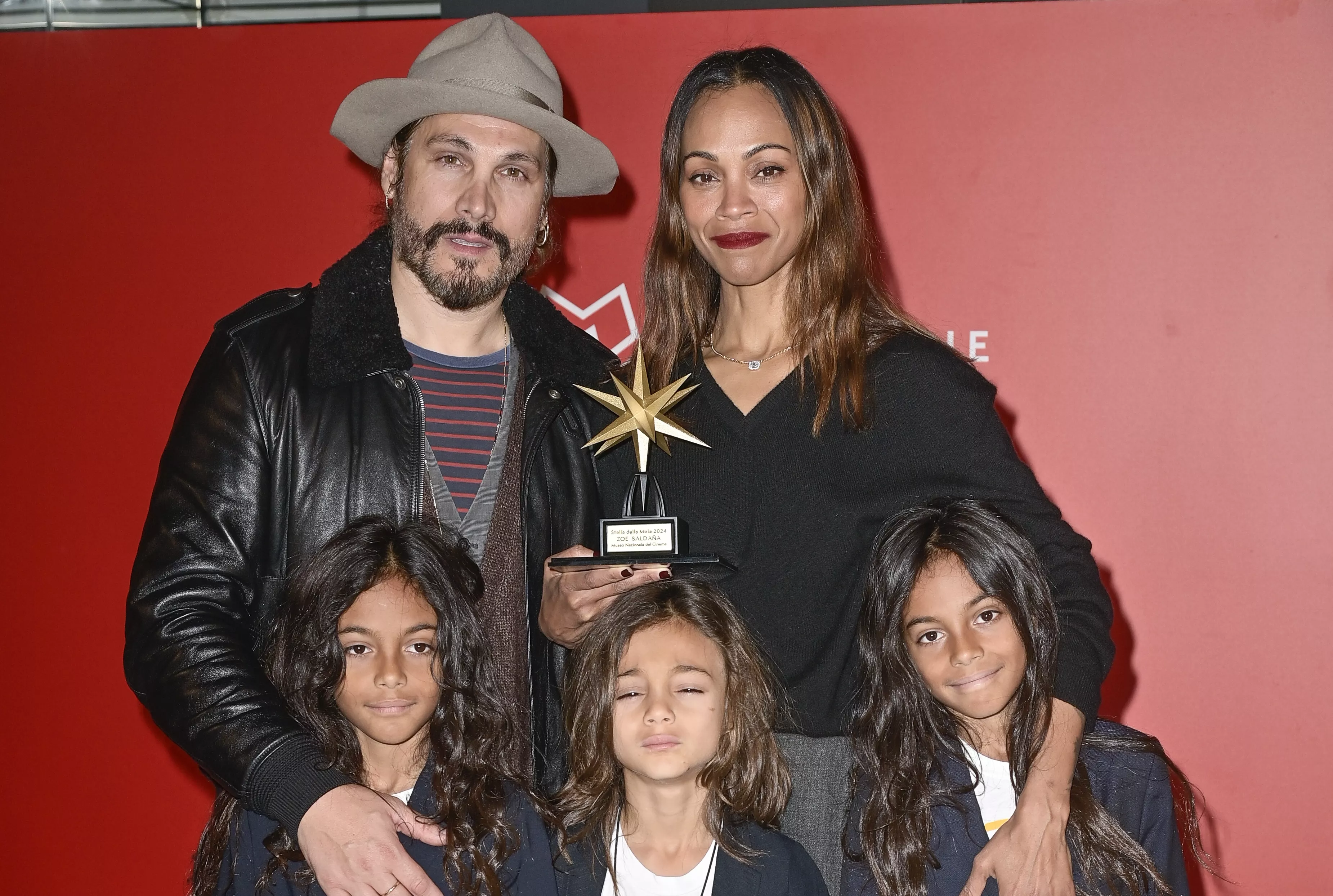 Zoe Saldaña hits the red carpet in rare appearance with 3 sons