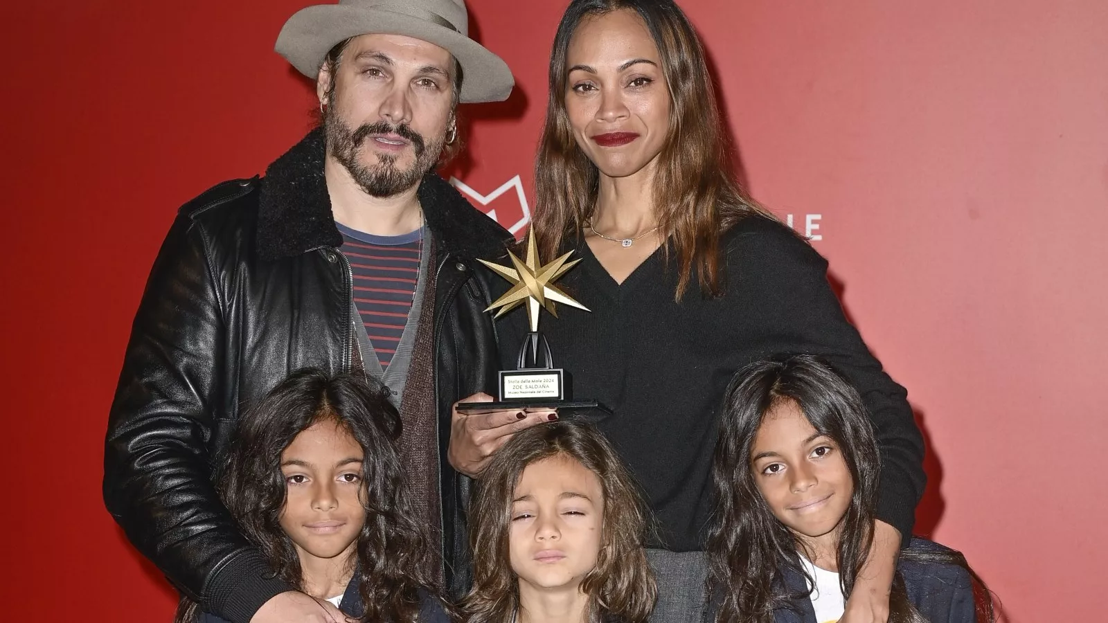 Zoe Saldaña hits the red carpet in rare appearance with 3 sons