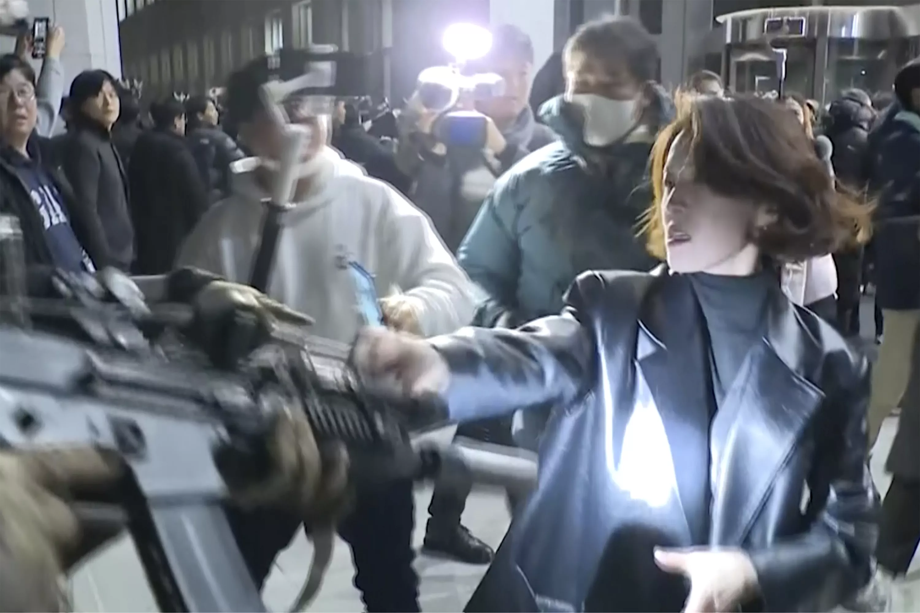 Woman's act of resistance becomes defining moment of South Korea chaos