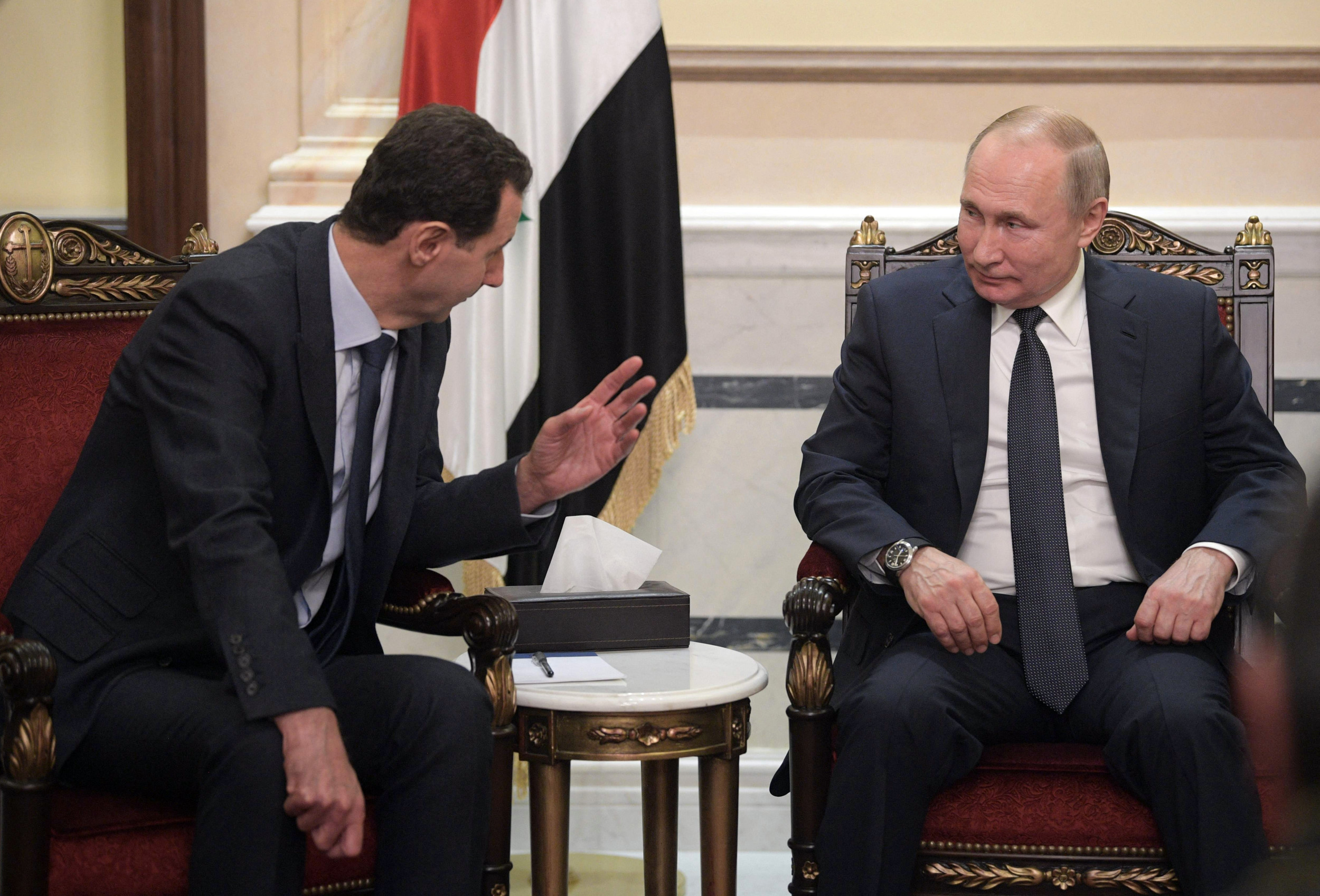 Vladimir Putin and Bashar al-Assad are seen in Damascus on January 7, 2020. (Getty Images)