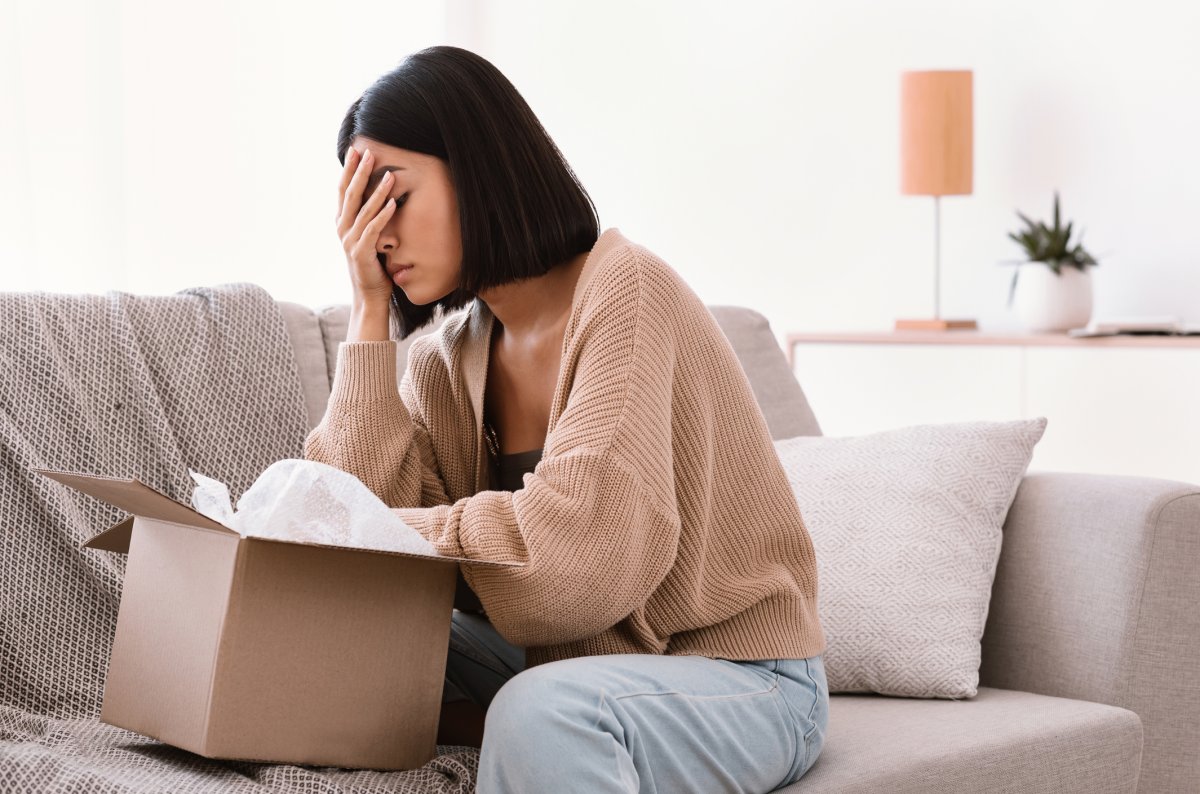 Stock image of woman disappointed with gift.