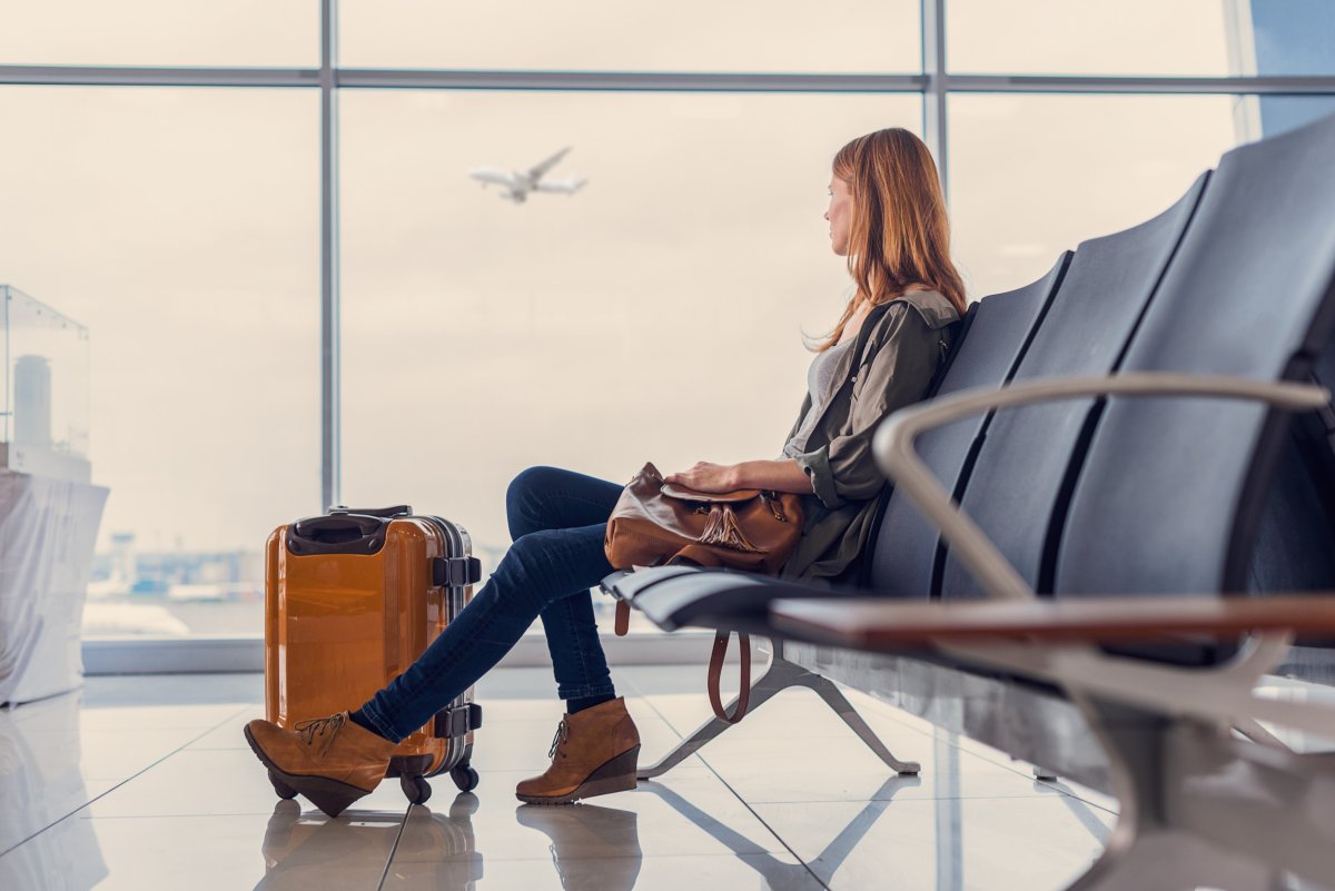 woman waits for plane boarding