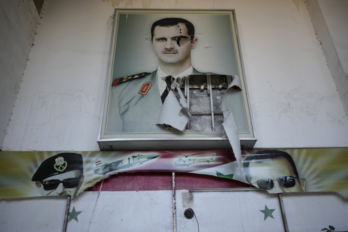 Torn Assad Poster