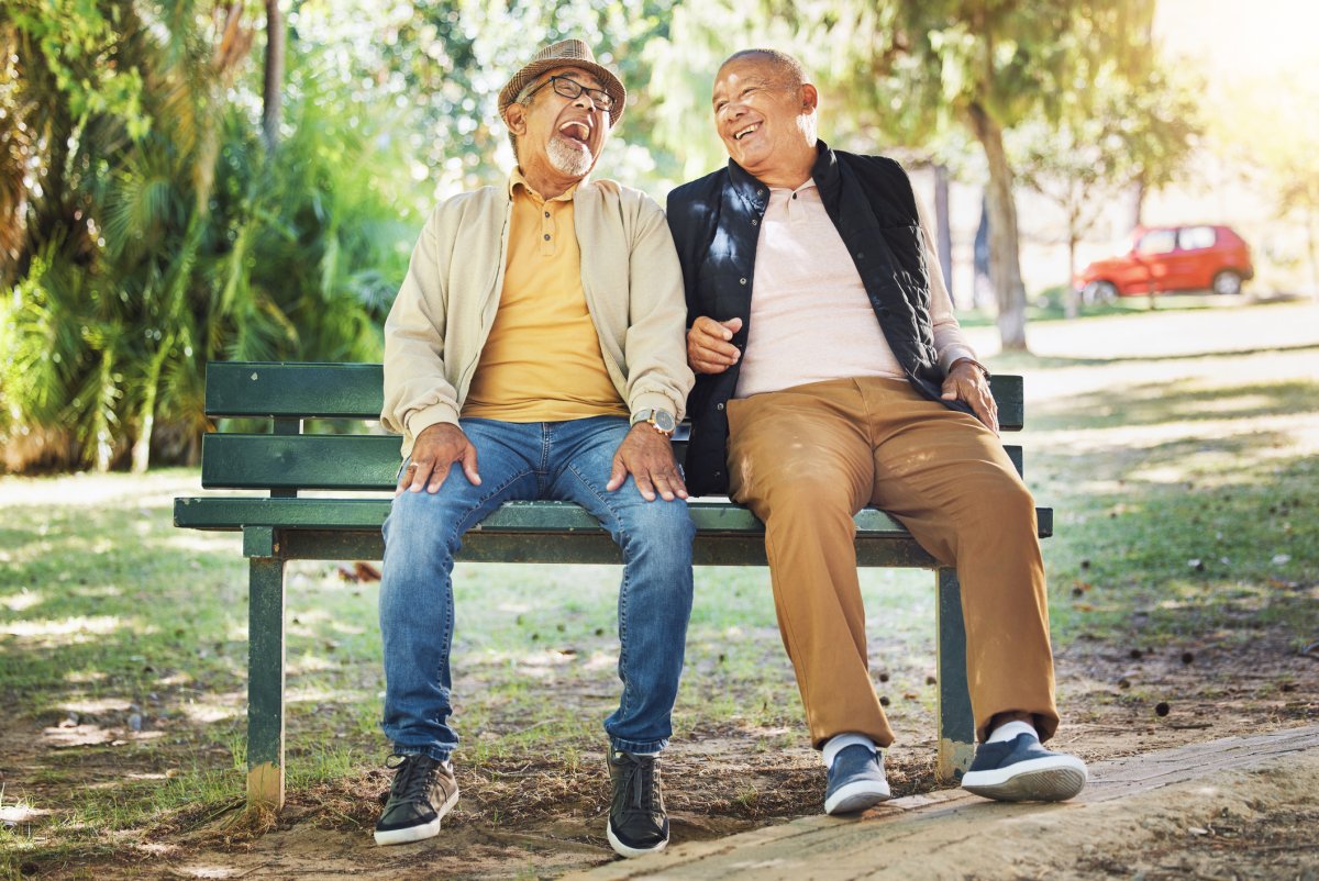 elderly friends laugh together