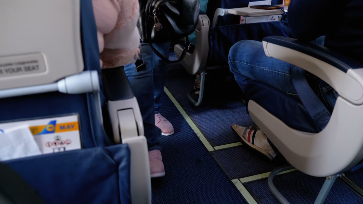 Passengers board a flight on small plane