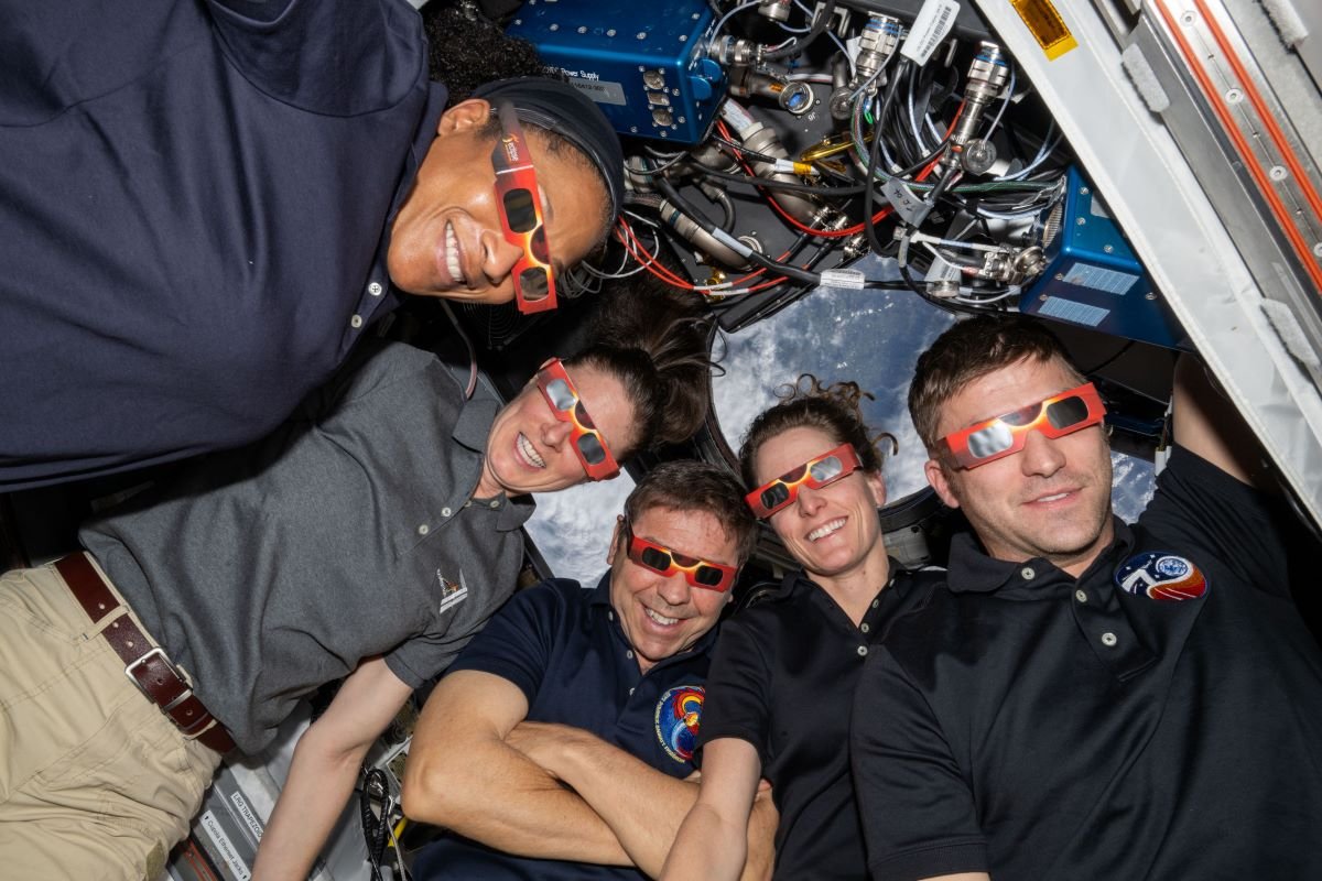 Astronauts wear eye-protecting specs