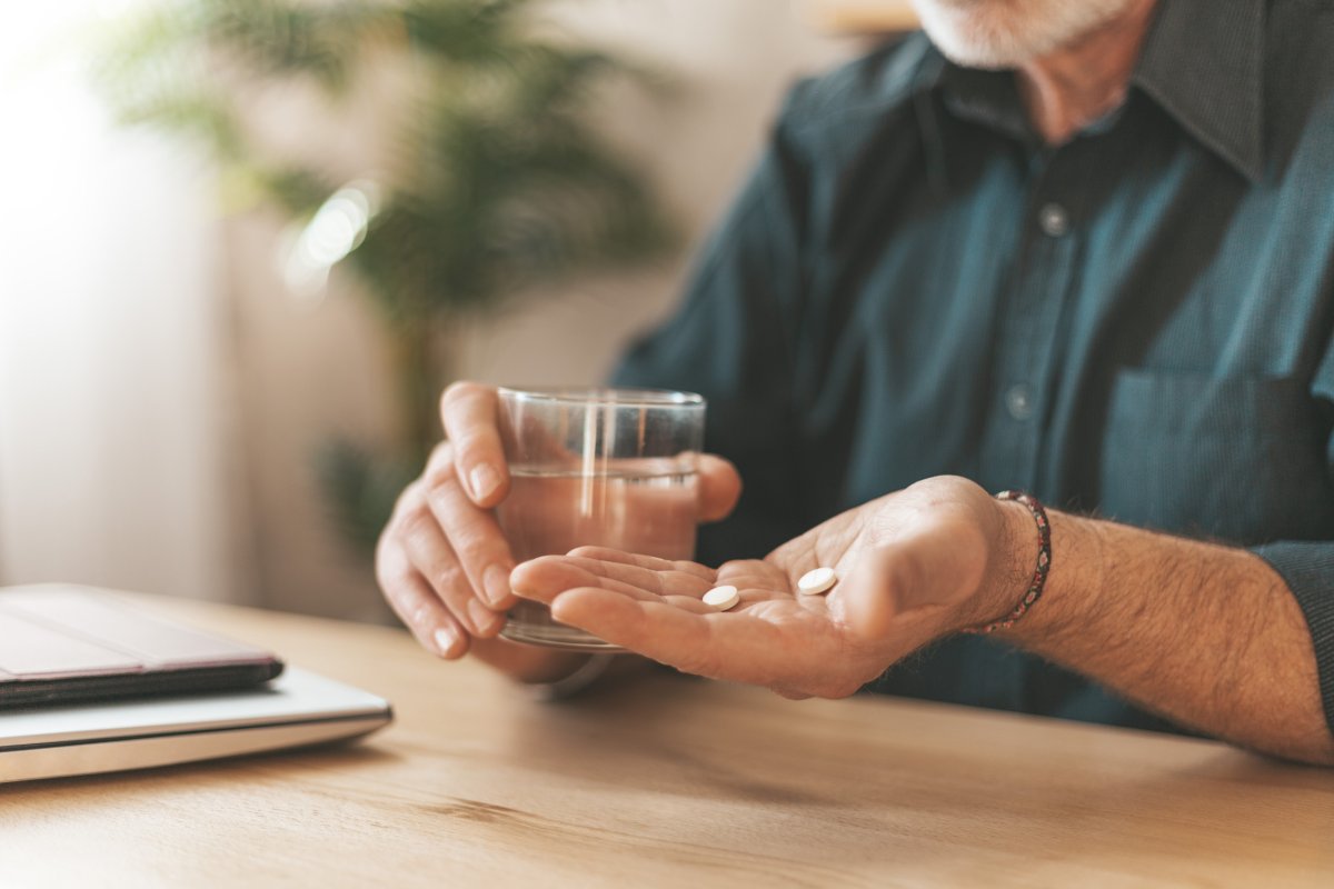 Older man takes pill