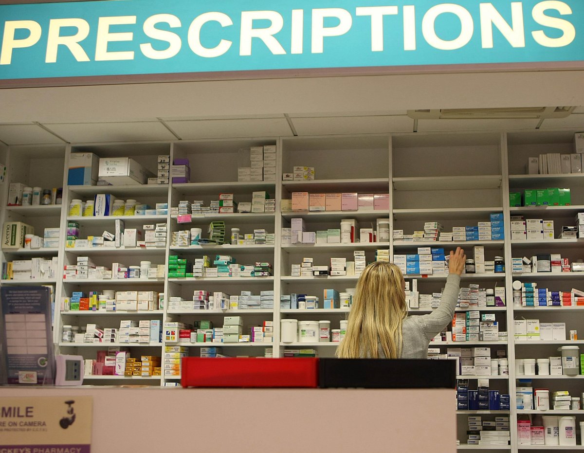 Pharmacist stocking shelves 