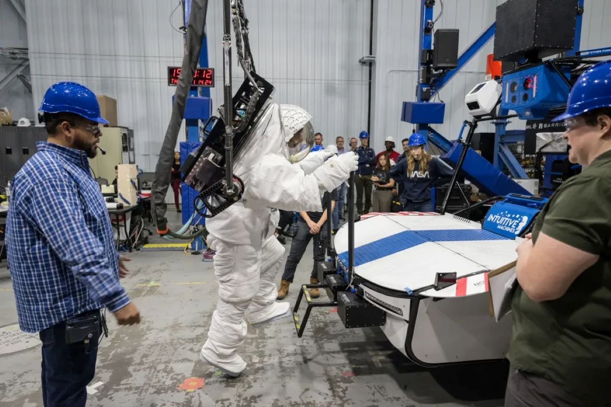 Astronaut climbing onto rover. 