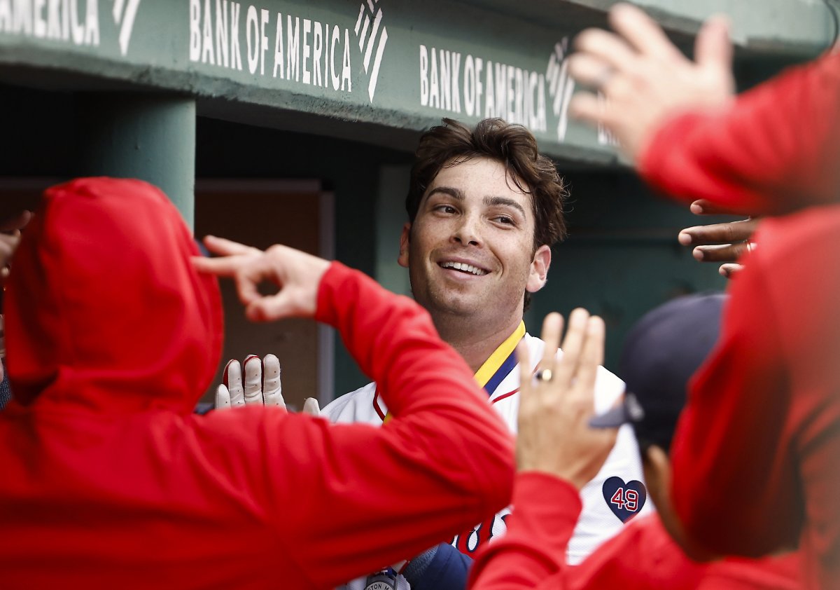 Triston Casas smiles in Red Sox dugout.