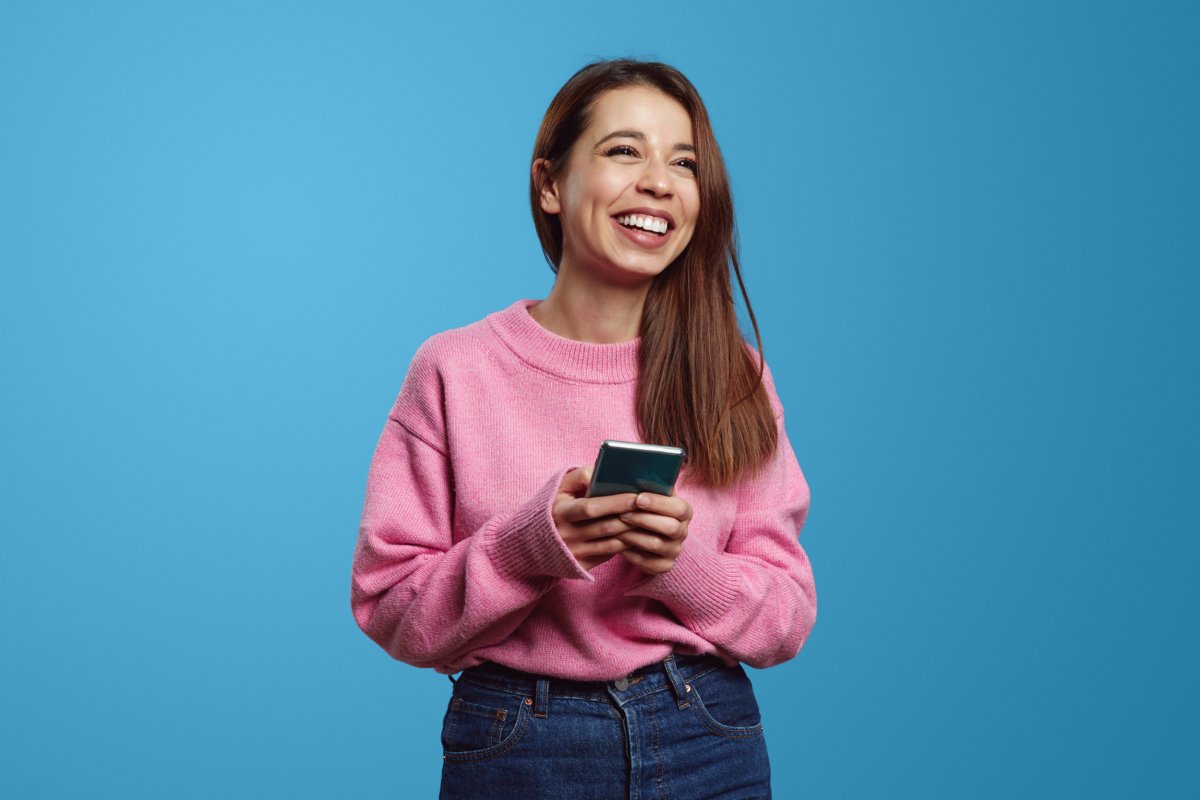 Woman uses telephone