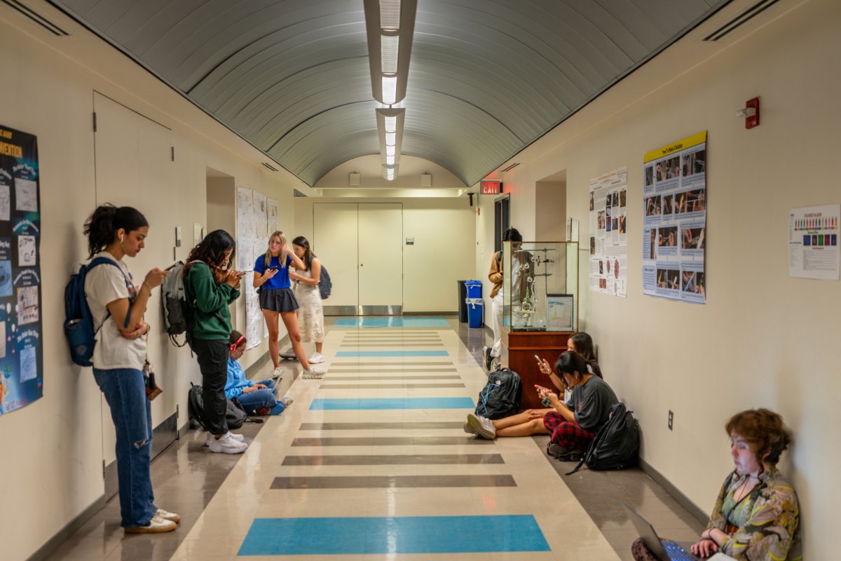  Students wait in a hallway