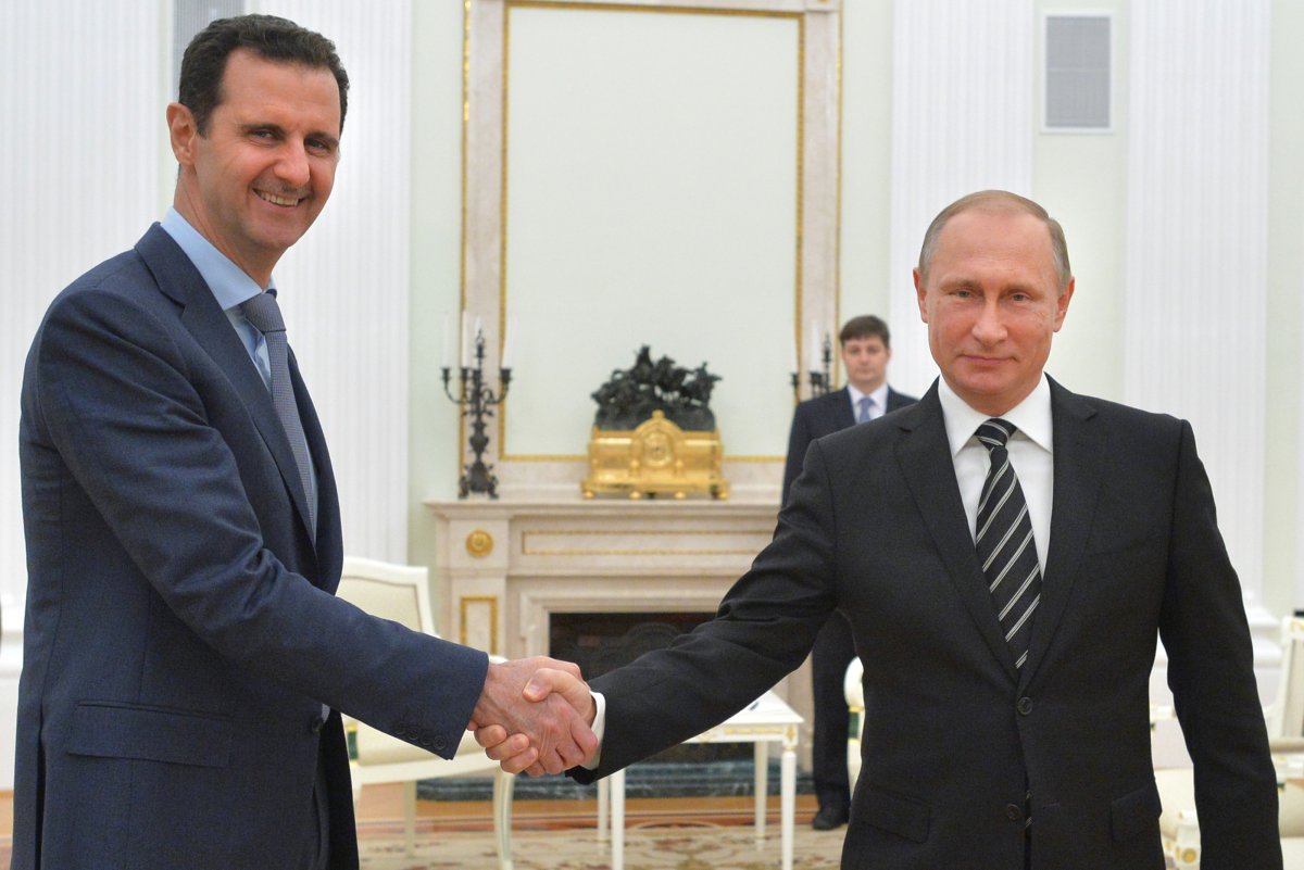 Vladimir Putin and Bashar Al-Assad Shaking Hands