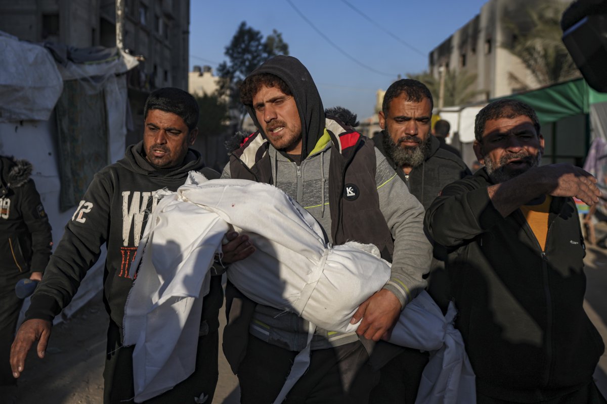 Palestinians carry the body of a relative