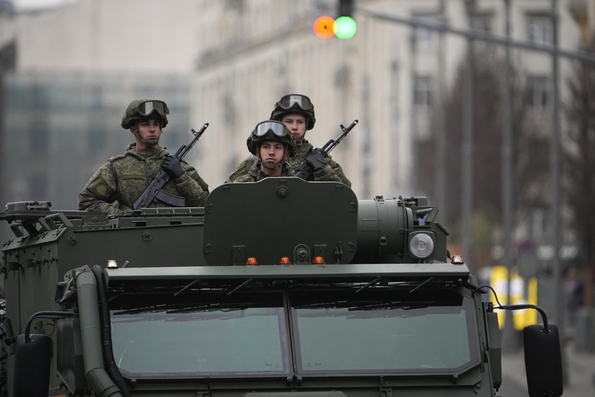 Russian Soldiers Driving a Military Vehicle 