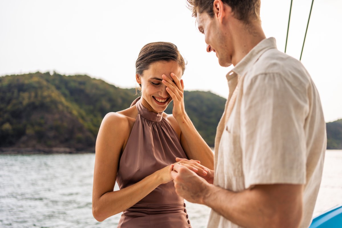 A man proposes to his girlfriend outside