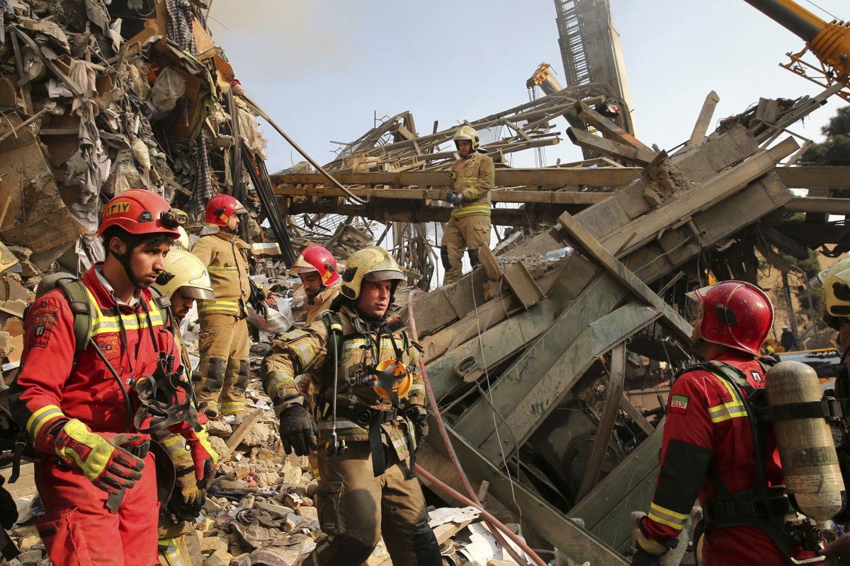 Iranian Firefighters at Collapsed Building Site 