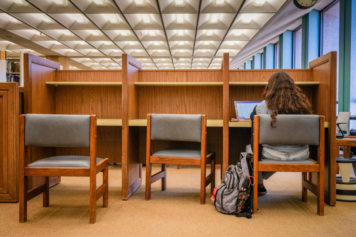 A student studies in Perry-Castaneda Library