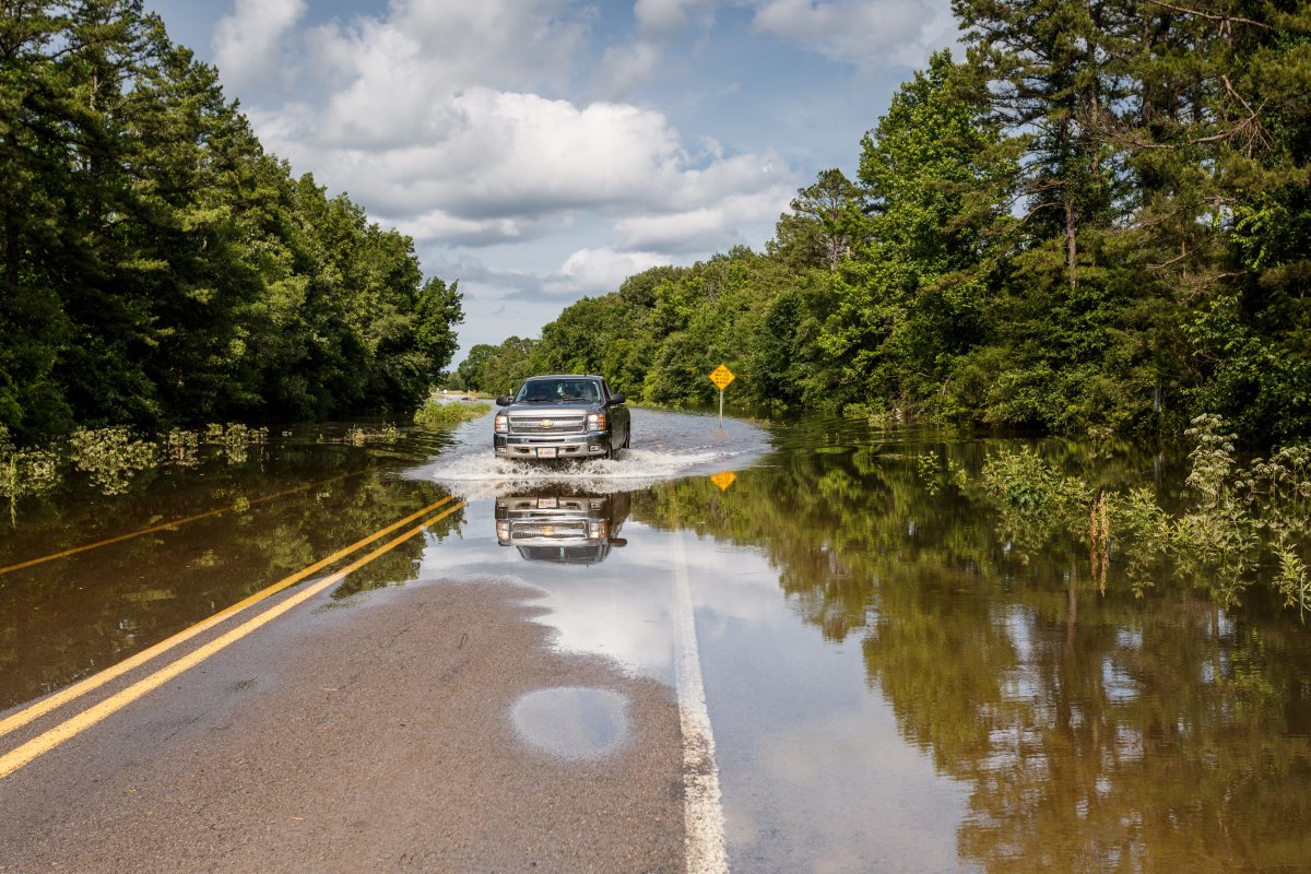 truck driving on flooded highway arkansas