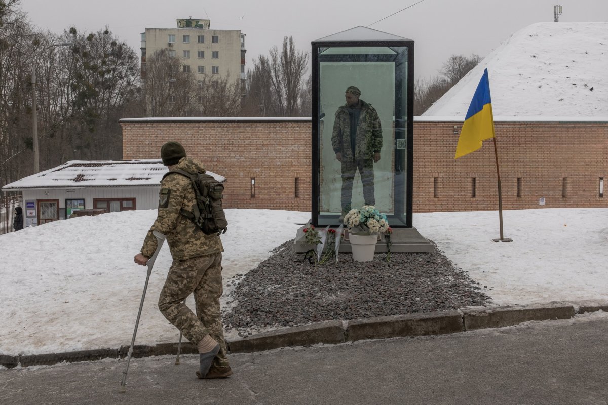 A Ukrainian military member on crutches 