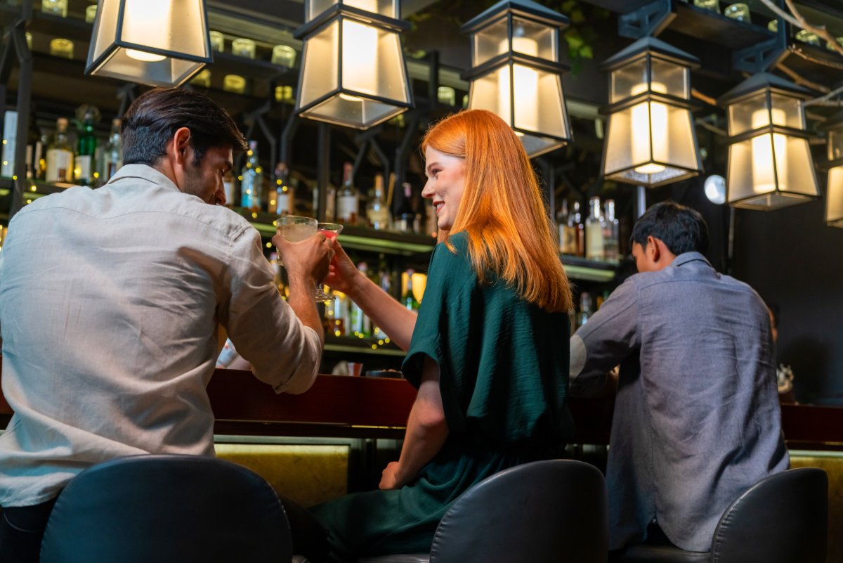 Man flirting with woman at a bar