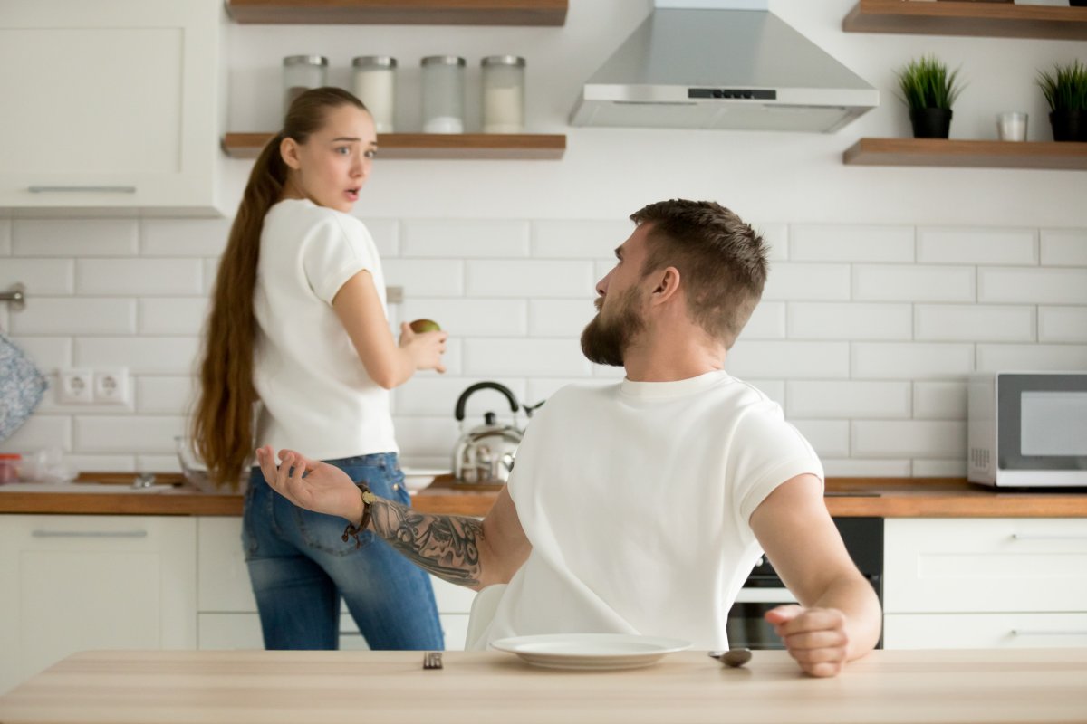 Man and woman arguing in kitchen