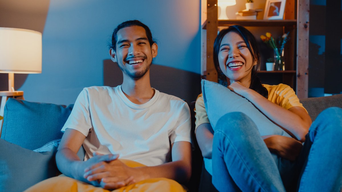 Man and woman watching a movie together