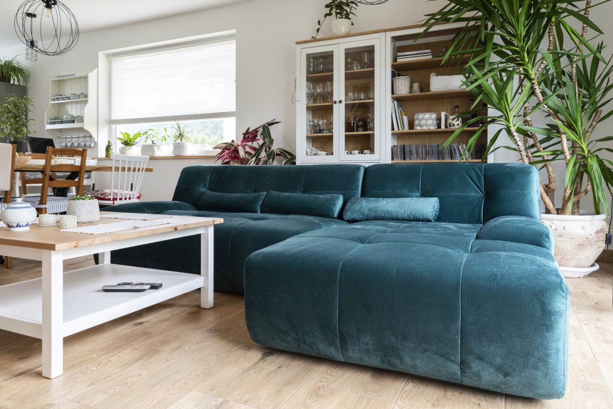 Turquoise green L-shaped sofa.