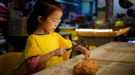 Little girl and archaeology activity