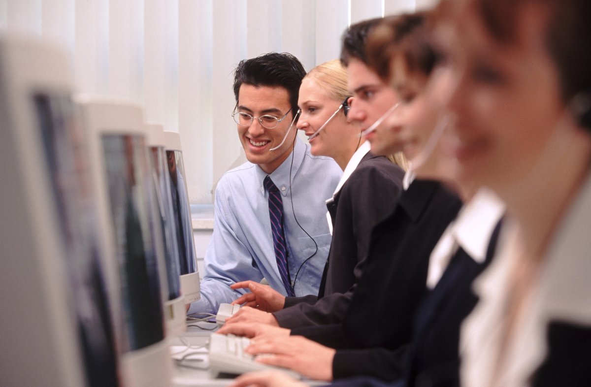 rows of computers and employees