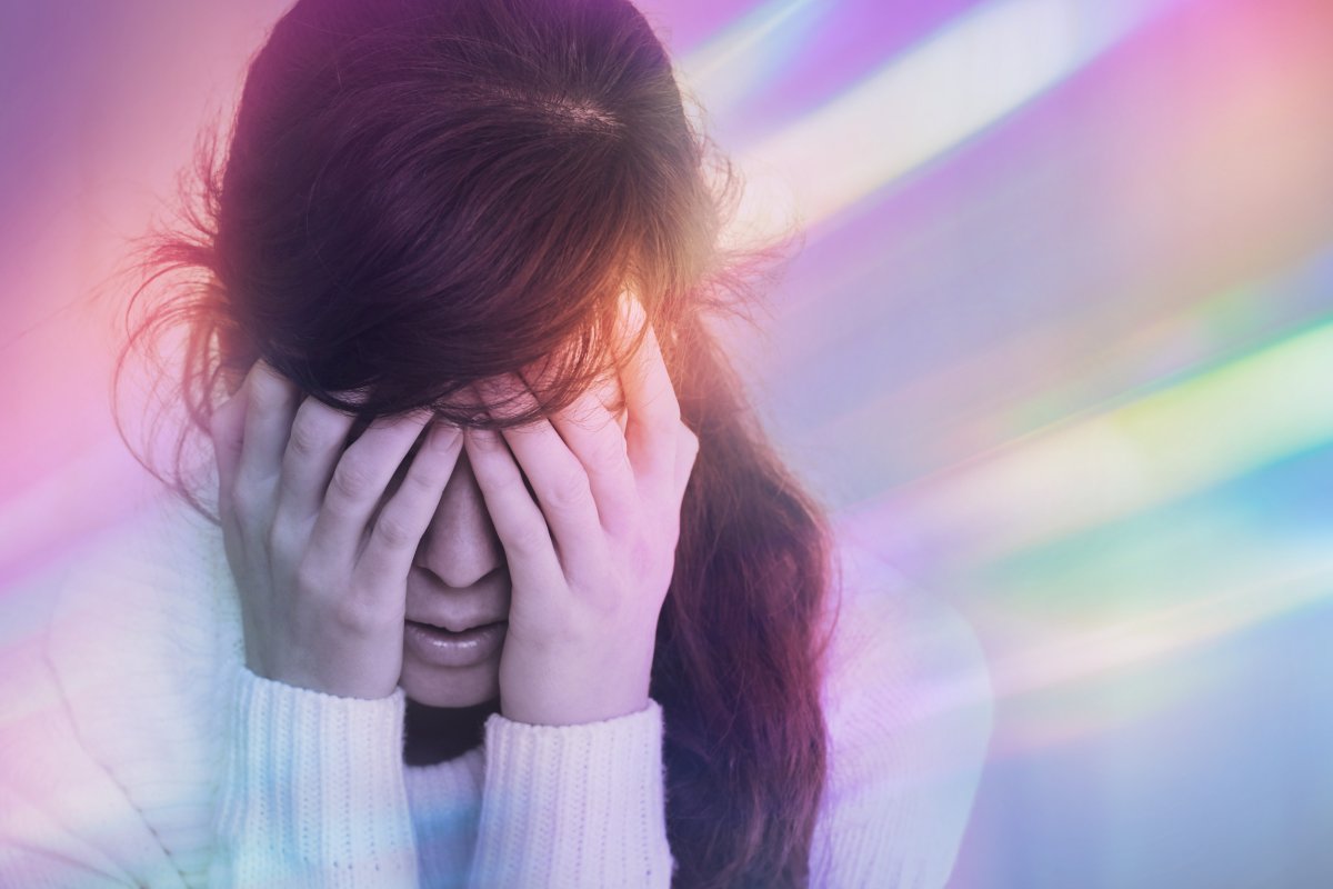 Stock of a woman with a migraine