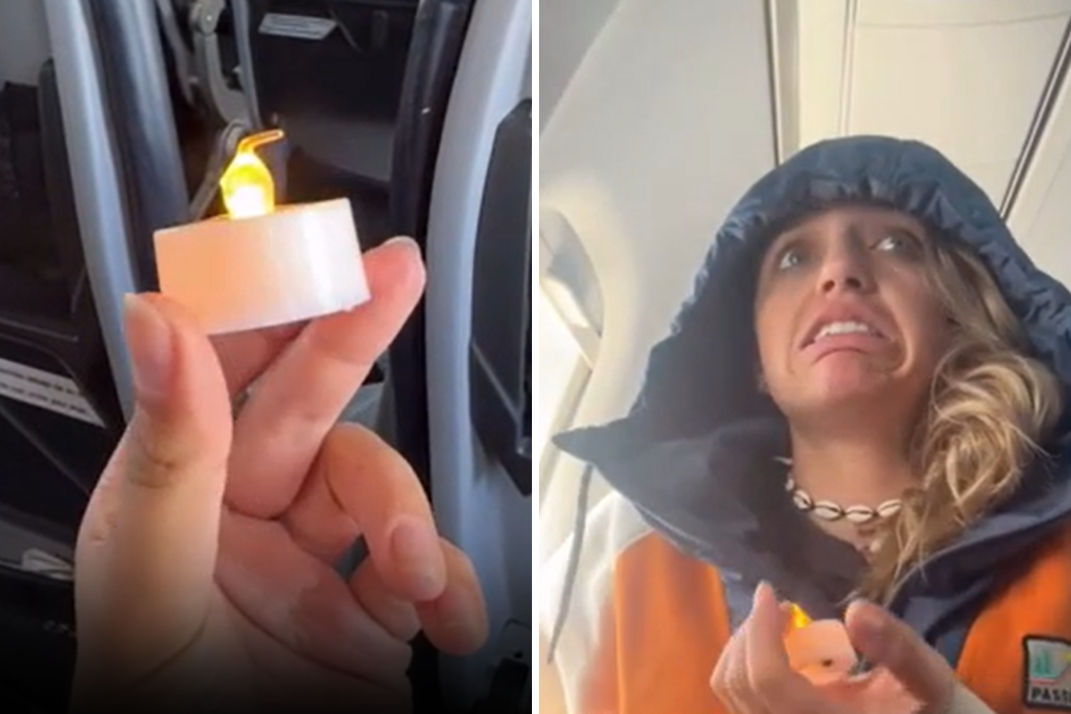 Jula Vadini worried on flight holding candle