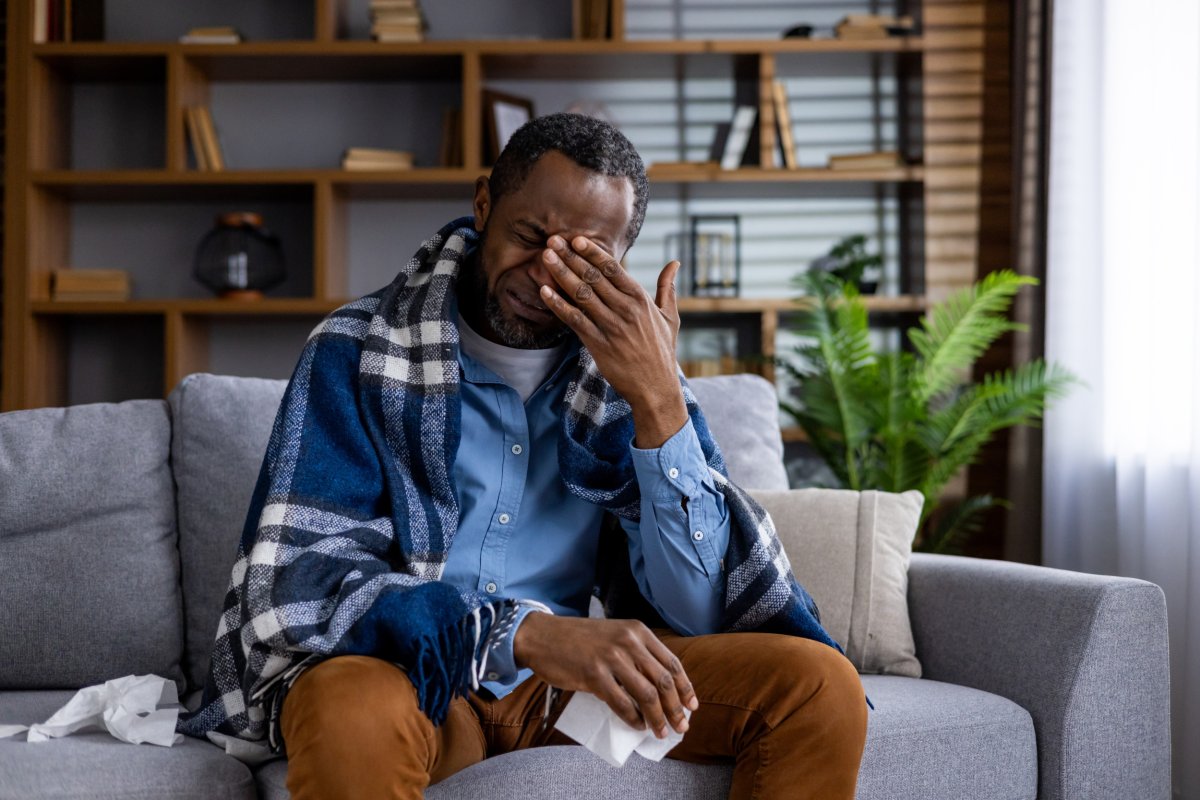 Stock image of a man with flu