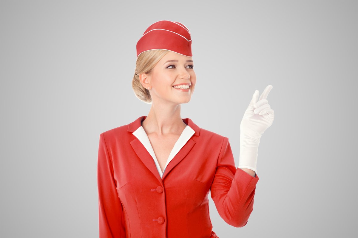 Flight attendant with retro-themed uniform