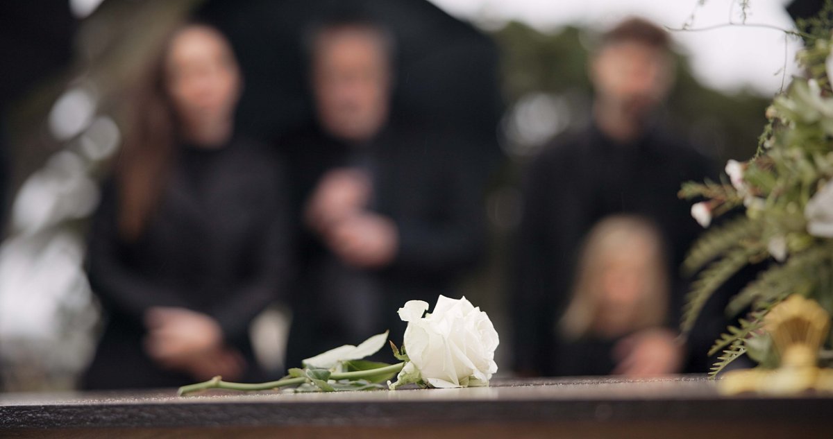 A family gathers at a funeral