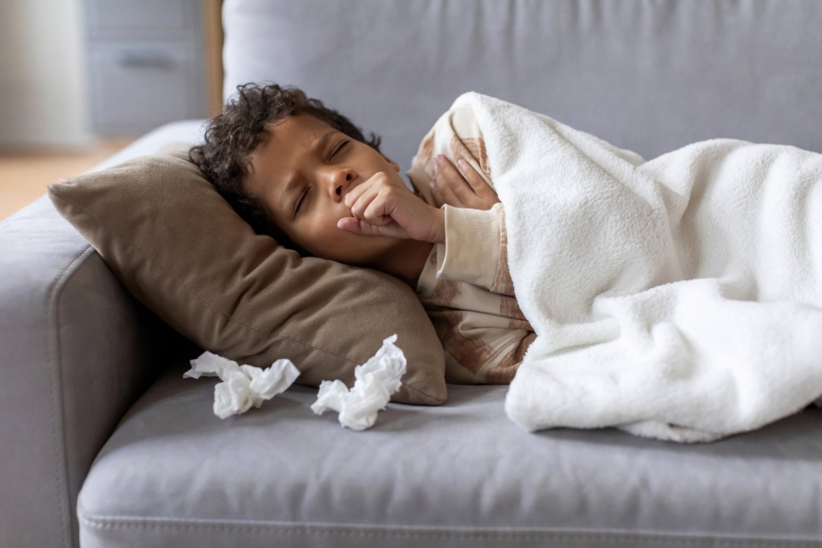 Stock image of a boy with flu
